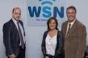 WSN-IP-Anywhere staff and a screen showing maritime traffic and ships with a satellite Internet access in real time.