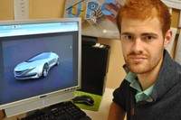 El estudiante de la ESEIAAT de la UPC, Jan Freixa, con el prototipo de su vehículo deportivo y de conducción autónoma, inspirado en un jardín japonés.